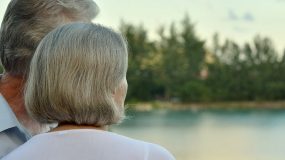ACT On Alzheimer's Lakes Area couple looking at lake